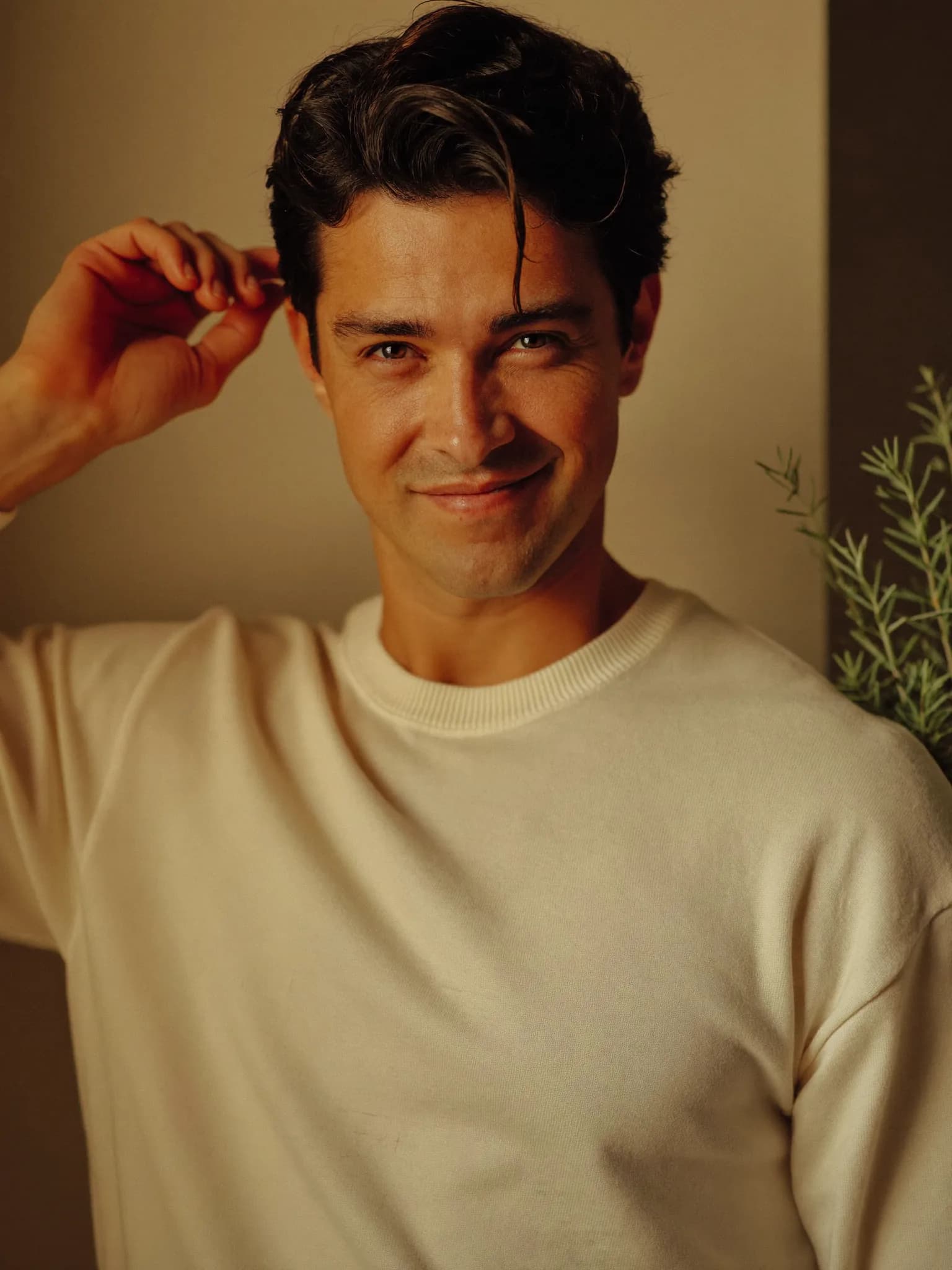 A calm, confident portrait of a man in his 40s — the steady vitality a hormone optimization program supports.
