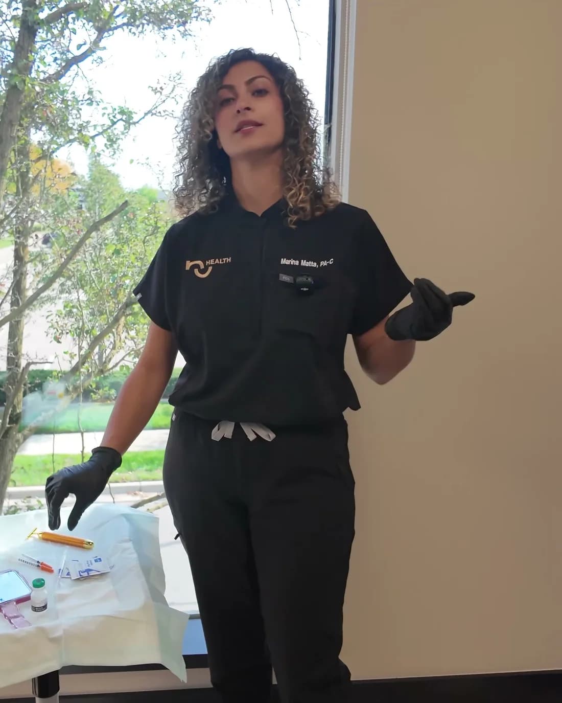 Marina Matta, PA-C, in a NuHealth treatment room in Royal Oak