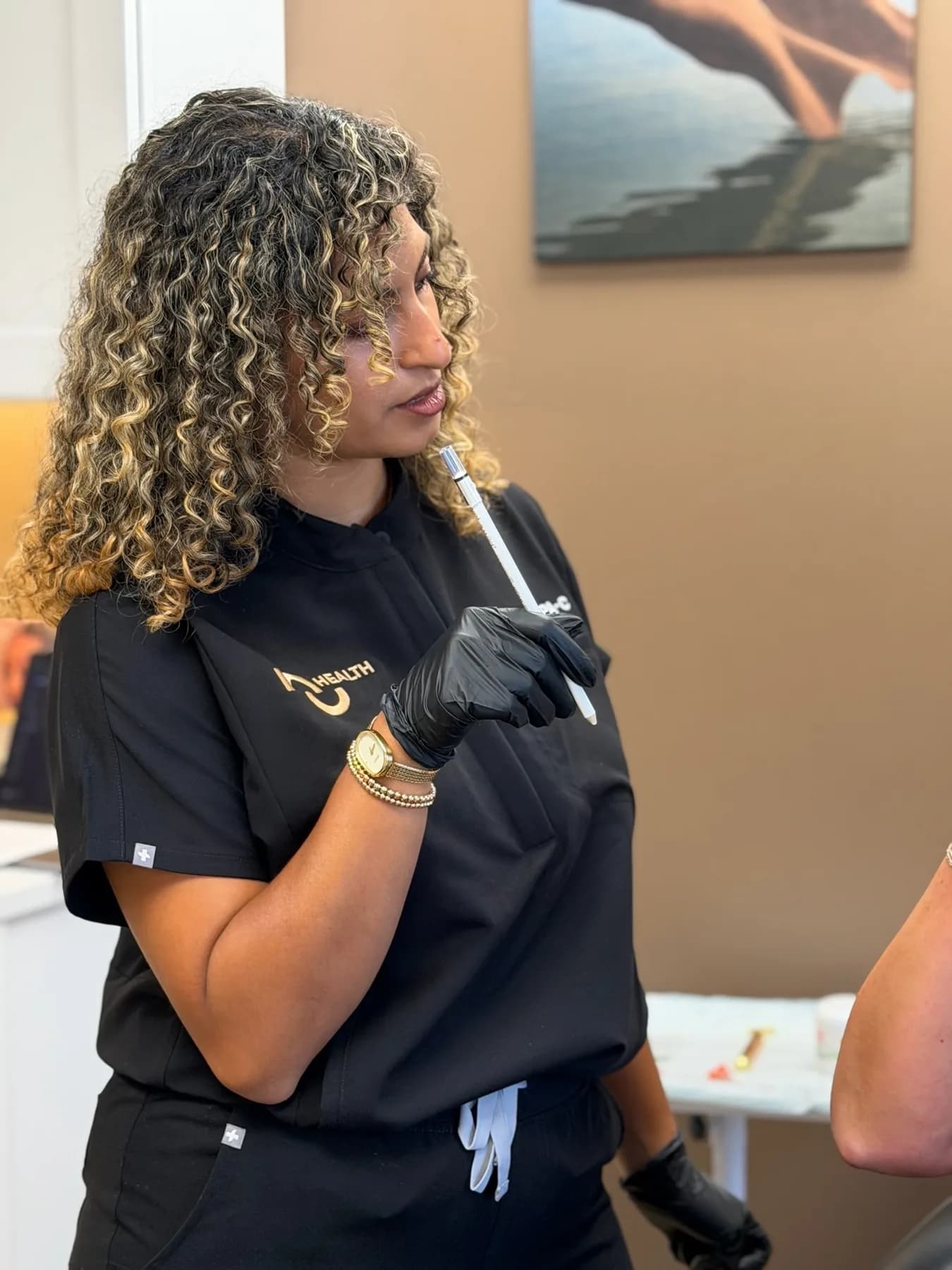 Marina Matta, PA-C, drawing up a Botox syringe in the NuHealth Royal Oak treatment room