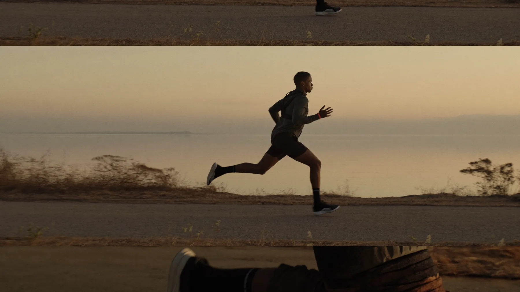 A fit man in his mid-forties running along a coastal path at sunrise, the steady vitality that balanced hormones support